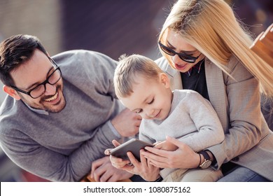 Family watching cartoon outdoors,having fun. - Shutterstock ID 1080875162