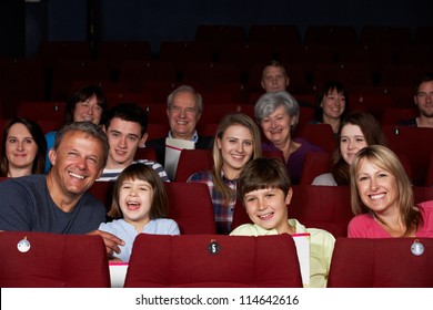 Family Watching Film In Cinema