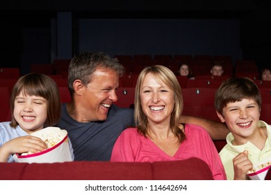 Family Watching Film In Cinema