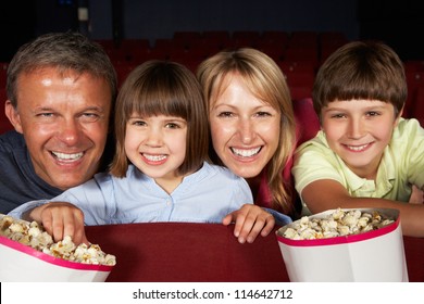 Family Watching Film In Cinema