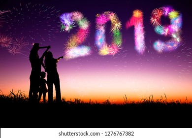 Family Watching Fireworks And Happy New Year 2019 Concept