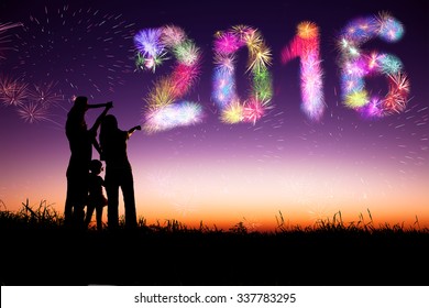 Family Watching Fireworks And Happy New Year 2016 Concept