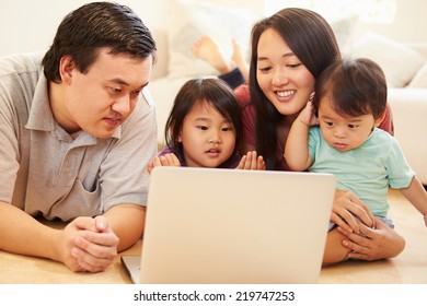 Family Watching Movie On Laptop At Home