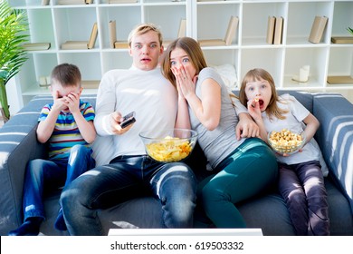 Family Watching Scary Movie At Home.