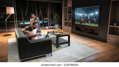 A family is watching a soccer moment on the TV and celebrating a goal, sitting on the couch in the living room. The living room is made in 3D. - Shutterstock ID 1230788539