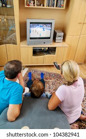 A Family Watching Tv With Tv