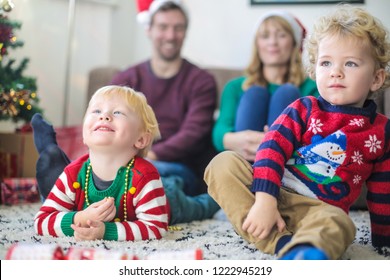 Family Watching Tv All Together, Wearing Christmas Clothes