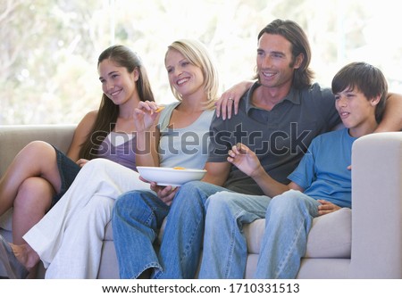 Similar – Sisters, teenage girl and her younger sister pushing hay bale playing together outdoors in the countryside