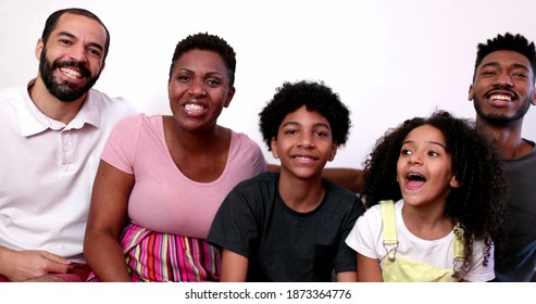 Family Waving Hello To Camera Speaking Video Conference POV