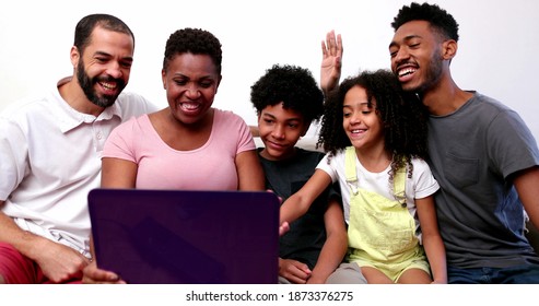 Family Waving Hello To Camera Speaking Video Conference POV