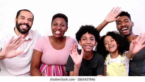 Family Waving Hello Or Goodbye To Camera. Happy Mix Race Parents And Kids