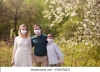 Family Weared In Funny Anti-viral Masks Outdoors. Homemade Mask With Smile. Facemask For Safety At  Quarantine. Face Mask Against Infection. Smile & Stay Safe. Safety Spring Park Walk In Pandemic Time