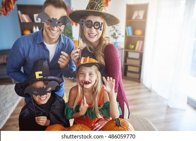 Family Wearing Funny Halloween Masks
