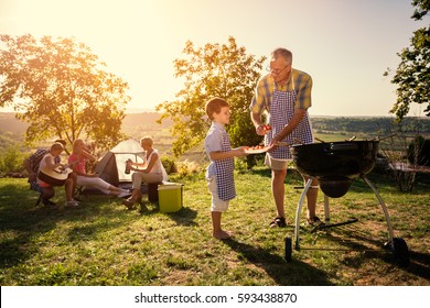 Family Weekend With Barbecue In Park
