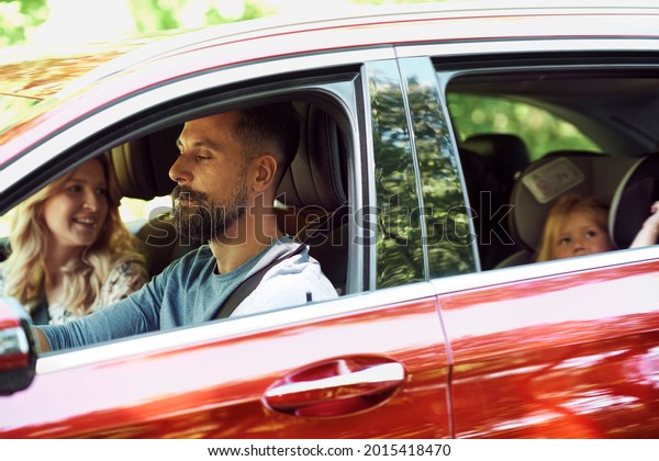 Family while trip driving by\
car