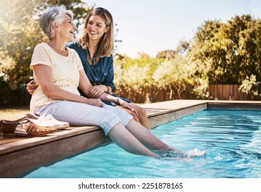 Family, women by pool and relax together with love and care, quality time in summer vacation. Elderly mother, daughter and vacation, outdoor swimming pool and wellness lifestyle with happy family - Powered by Shutterstock