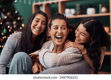 Family, women and laughing in lounge for Christmas, holiday and celebration in living room. Happy, sisters and funny or together in home or apartment for connection, care or joke and hug for support - Powered by Shutterstock