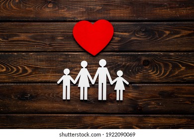Family wooden figure and heart shape. Life insurance concept