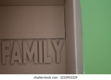 Family Word With Cardboard Box. Brown Folded Card Box.