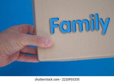 Family Word With Cardboard Box. Brown Folded Card Box.