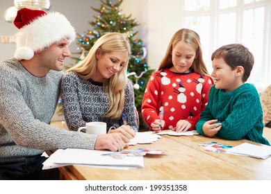 Family Writing Christmas Cards Together