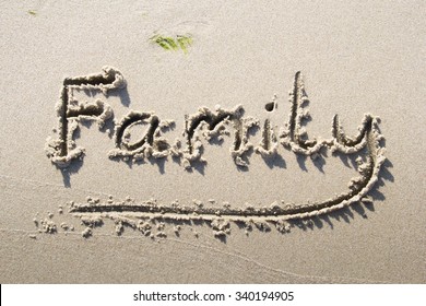 "Family" written on sand beach