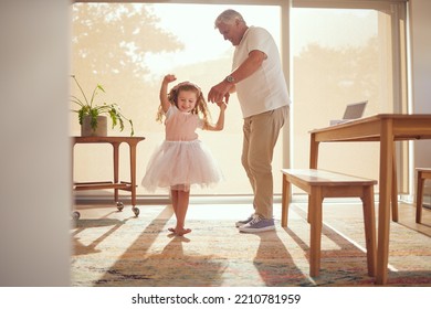 Family, Young Girl And Grandfather Dancing In Living Room Together. Grandparent And Grandchild In Family Home Doing Dance And Having Fun In The Morning. Old Man Enjoying Retirement With Child At Home