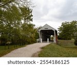 Famous 1870s Imes Bridge, a covered wooden bridge, in Madison County, Iowa. Photographed in early autumn on an overcast day.