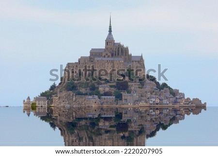 famous abbey of mont saint michel in the north of france at high tide