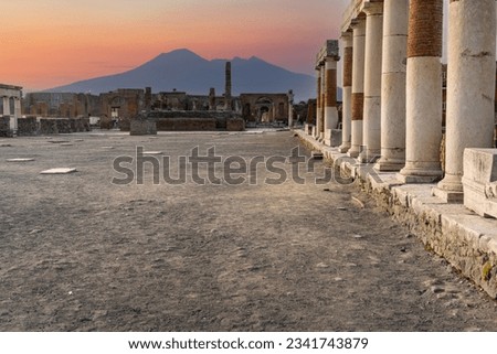 Famous ancient city of Pompeii (Scavi di Pompei) near Naples. The city was completely destroyed by the eruption of Mount Vesuvius in the background. Italy