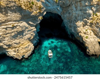 The famous arch and cave in Malta. The name is blue grotto.
