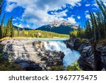 The famous Athabasca Falls. Mountain, river and waterfall make up magnificent landscapes. Rocky Mountains of Canada. Jasper Park. Travel and ecological tourism concept