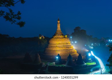 Famous And Beautiful Old Pagoda, Circular Shape, Inverted Bell Surrounded By Small Ones, Land Mark Of  Mrauk U, Rakhine, Myanmar. Blue Sky With Star Effects And Long Exposure Light.Tourist Destination