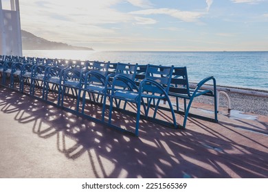 Famous blue chairs on the Promenade des Anglais in Nice - Shutterstock ID 2251565369