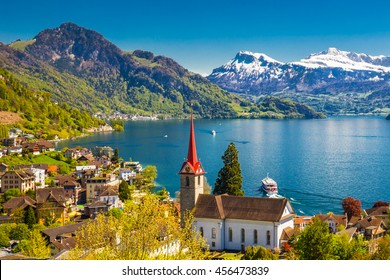 Famous boats on lake Lucerne (Vierwaldstatersee) in Weggis village with the view of Pilatus mountain and Swiss Alps in the background near famous Lucerne (Luzern) city, Switzerland