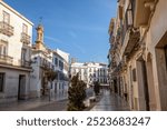 Famous Calle del Rio with its stately houses and the Virgen de las Angustias church in Priego de Córdoba, Cordoba, Andalusia, Spain, with nice daylight