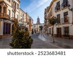 Famous Calle del Rio with its stately houses and the parish of the Virgen del Carmen in Priego de Córdoba, Cordoba, Andalusia, Spain, with beautiful daylight