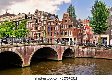 Famous Canal Houses Of Amsterdam With Bridge 