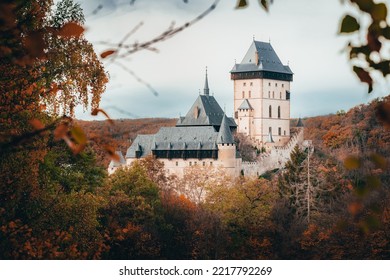 Famous Castle Karlstejn In Czech Republic With Autumn Atmosphere,during The Day. View Through The Treeline