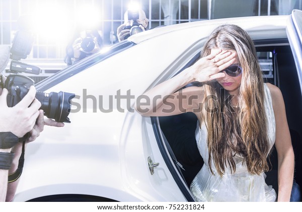 famous celebrity getting\
out of a limousine in front of a red carpet event, with flashing\
paparazzi 