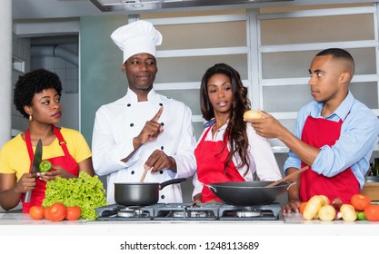 300 African american chef teaching women and men at kitchen Images ...