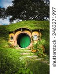 Famous circular green door in Hobbiton (Hobbit hole) in New Zealand