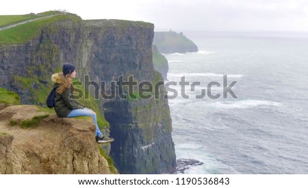 Similar – Ireland, Cliffs of Moher, woman, hiking