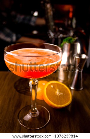 Famous color bright cocktails with alcohol, fruits and berries with rosemary and mint in dark background