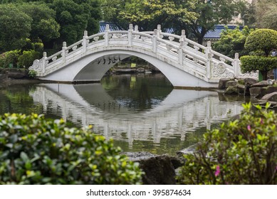 The Famous Curved Bridge With Its Reflection At Chiang Kai Shek Memorial Hall On A Sunny Day, Taipei, Taiwan