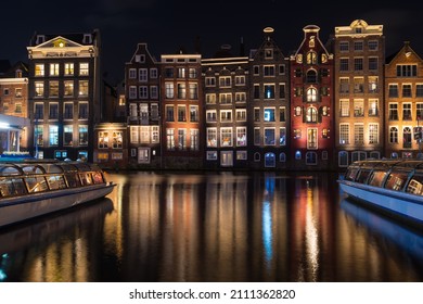 Famous Dancing Canal Houses At The Damrak Canal At Night 