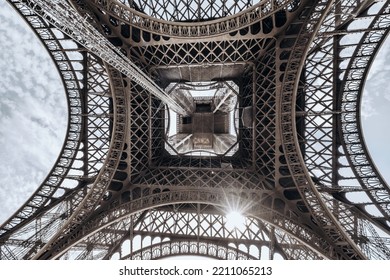 The famous Eiffel Tower in Paris with a dramatic sky