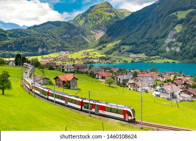 Famous electric red tourist panoramic train in swiss village Lungern, canton of Obwalden, Switzerland - Powered by Shutterstock