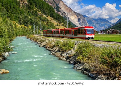  Famous Electric Red Tourist Train In Tasch,Valais Region,Switzerland,Europe