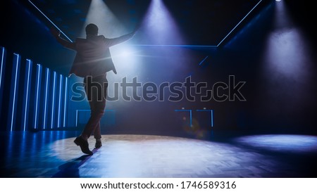 Famous Entertainer Gets on the Stage, Greets Audience, Starts Performance. Software Company Founder, Tech Marketing Guru Making a Pitch, Presentation Speaker Giving Talk. Cinematographic Back View